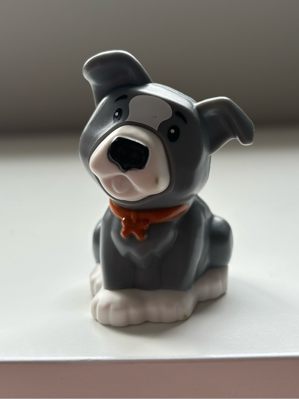 Little people grey and white dog